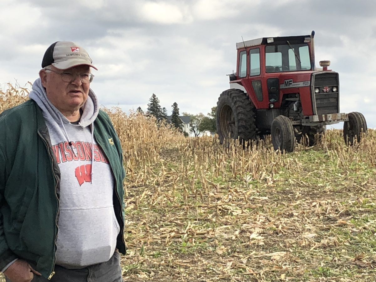 farmer in field with tractor
