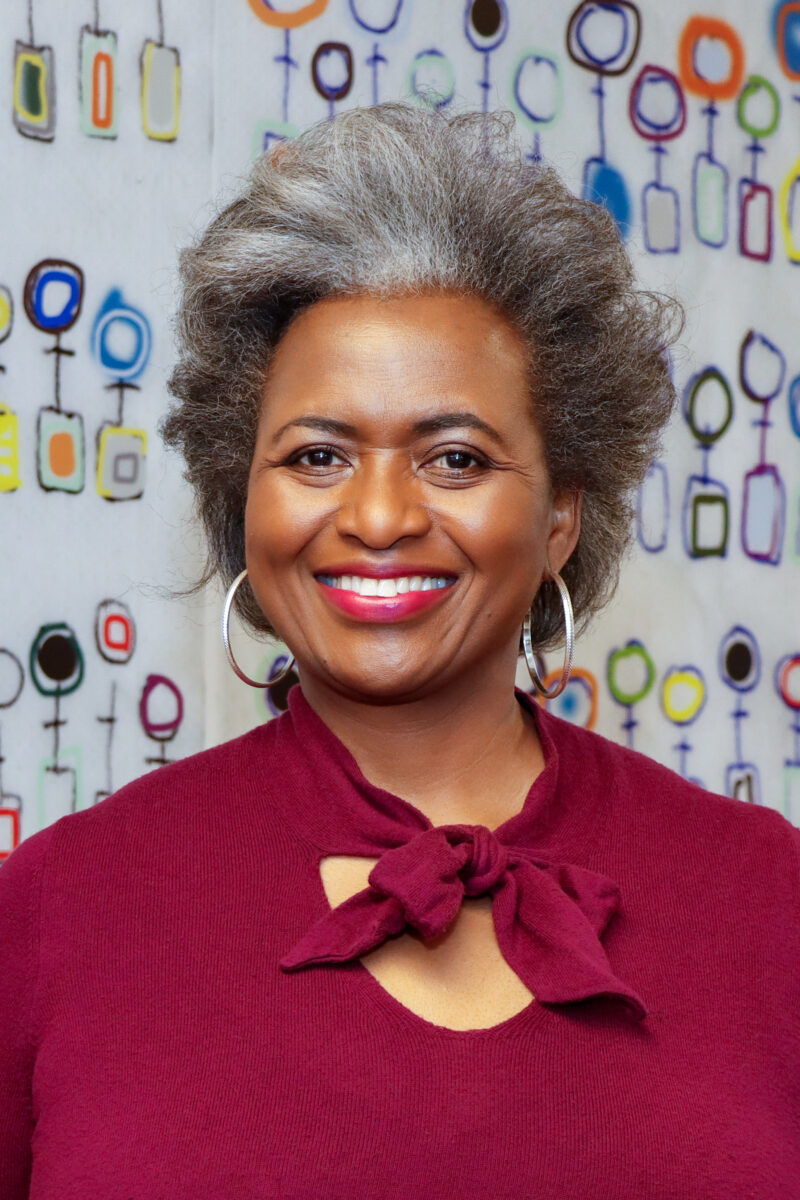 woman with red dress and colorful background